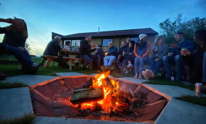 Gathering around the fire.